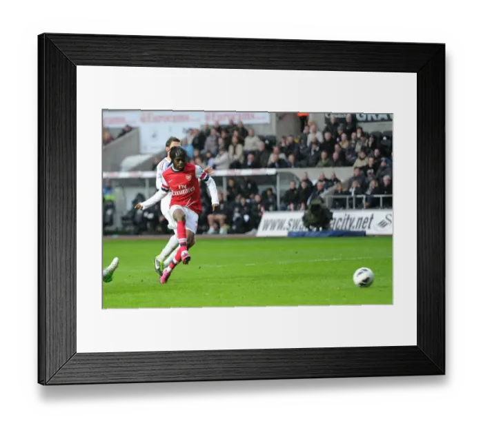 Framed Print : Gervinho Scores Against Angel Rangel: A Premier League Goal Clash between Swansea City and Arsenal, March 2013
