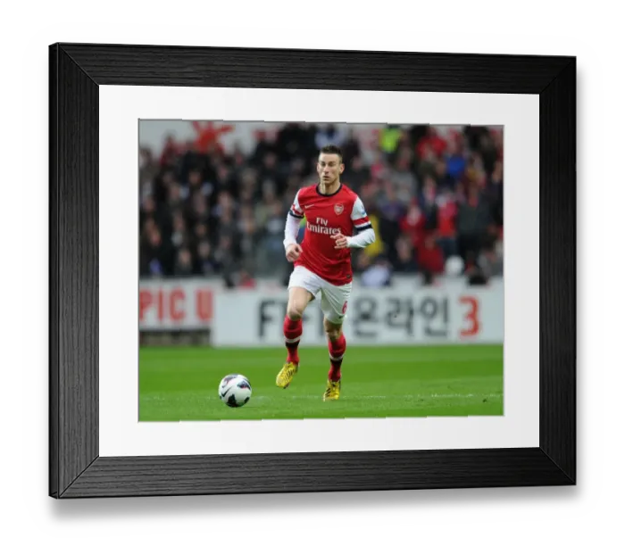 Framed Print : Laurent Koscielny Focuses in Swansea City vs Arsenal Clash (2012-13)