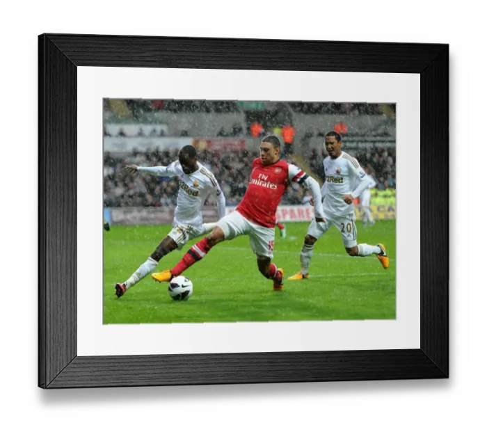 Framed Print : Arsenal's Alex Oxlade-Chamberlain Fends Off Swansea's Nathan Dyer and Jonathan De Guzman Framed Print : Arsenal's Alex Oxlade-Chamberlain Fends Off Swansea's Nathan Dyer and Jonathan De Guzman