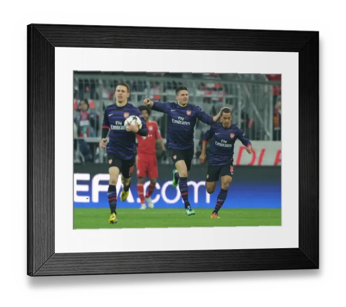 Framed Print : Olivier Giroud and Theo Walcott Celebrate Arsenal's Goal Against Bayern Munich in Champions League Showdown