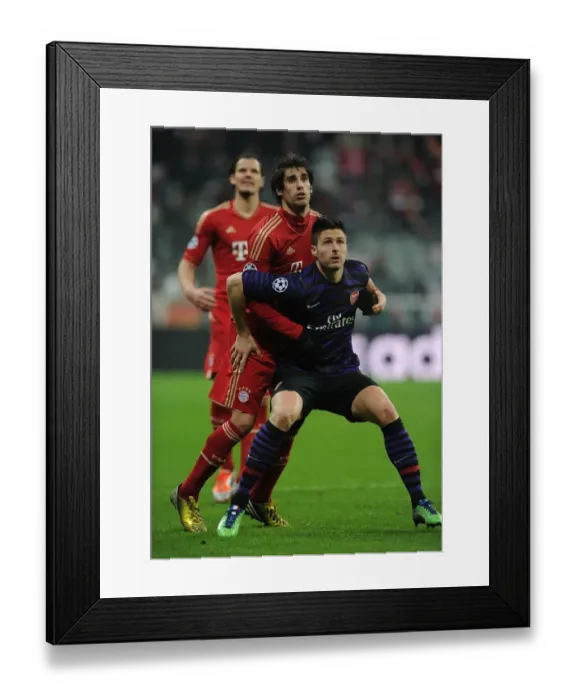 Framed Print : Clash of Titans: Olivier Giroud vs. Javi Martinez - Bayern Munich vs. Arsenal, UEFA Champions League 2013