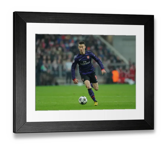 Framed Print : Laurent Koscielny: Arsenal's Fortitude in the Face of Bayern Munchen in the UEFA Champions League Framed Print : Laurent Koscielny: Arsenal's Fortitude in the Face of Bayern Munchen in the UEFA Champions League