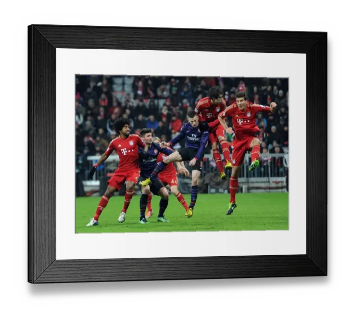 Framed Print : Laurent Koscielny's Header: Arsenal's Victory Moment Against Bayern Munich in the UEFA Champions League (2012-13)
