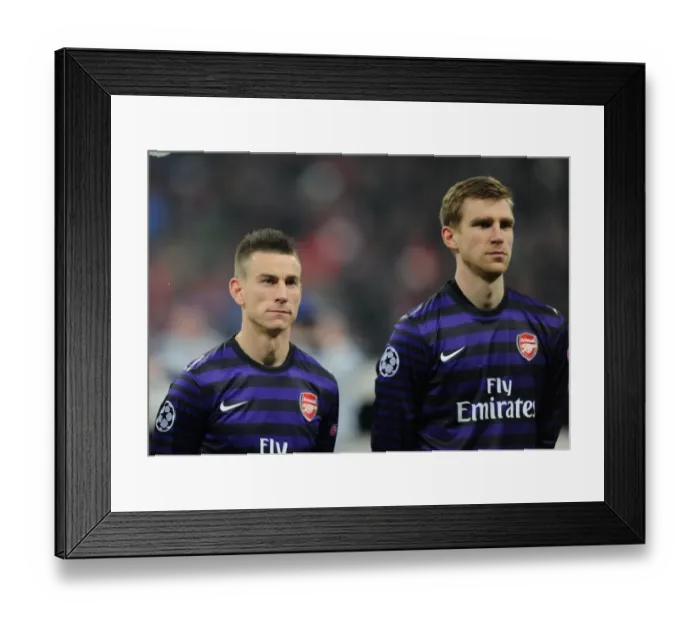 Framed Print : Laurent Koscielny and Per Mertesacker (Arsenal). Bayern Munich 0: 2 Arsenal. UEFA Champions League