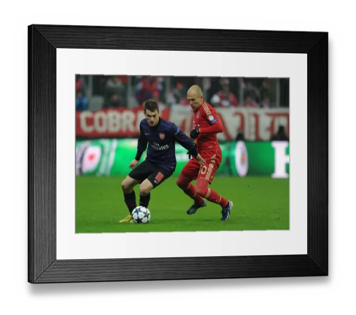 Framed Print : Ramsey vs Robben: Battle in Munich - Arsenal's Aaron Ramsey Outmaneuvers Arjen Robben in UEFA Champions League Clash