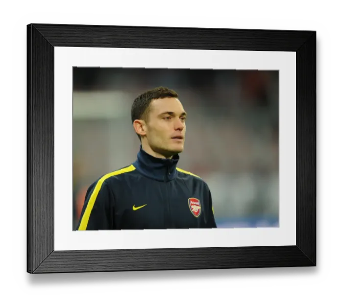 Framed Print : Thomas Vermaelen (Arsenal). Bayern Munich 0: 2 Arsenal. UEFA Champions League. Round of 16 Framed Print : Thomas Vermaelen (Arsenal). Bayern Munich 0: 2 Arsenal. UEFA Champions League. Round of 16