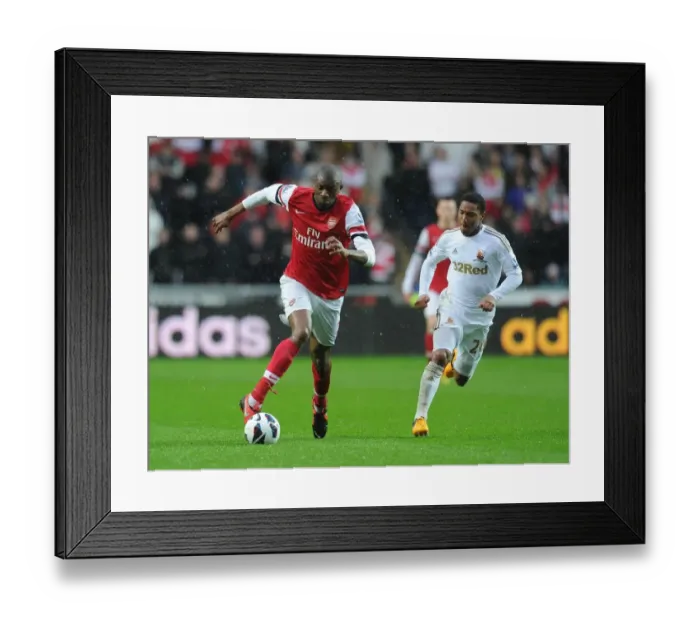 Framed Print : Abou Diaby Outmaneuvers Jonathan de Guzman: A Premier League Battle at Swansea City, 2012-13 Framed Print : Abou Diaby Outmaneuvers Jonathan de Guzman: A Premier League Battle at Swansea City, 2012-13