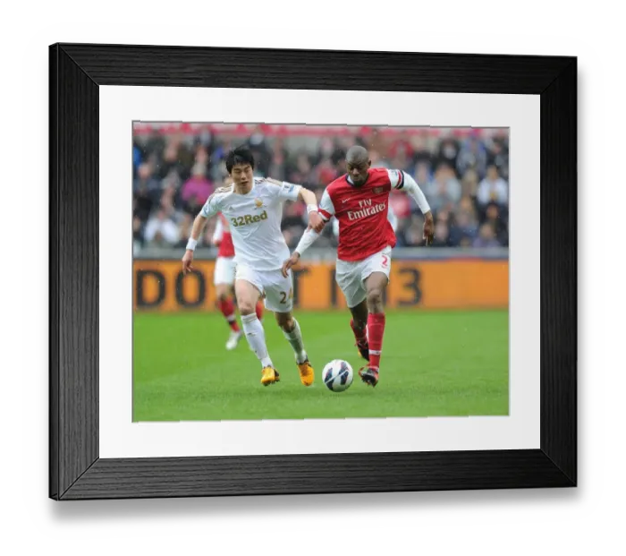 Framed Print : Abou Diaby Outmaneuvers Ki Sung-Yueng: A Premier League Battle at Swansea City, 2012-13 Framed Print : Abou Diaby Outmaneuvers Ki Sung-Yueng: A Premier League Battle at Swansea City, 2012-13