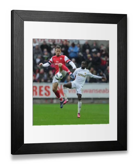 Framed Print : Monreal vs. Dyer: Intense Battle in Swansea City vs. Arsenal Premier League Clash Framed Print : Monreal vs. Dyer: Intense Battle in Swansea City vs. Arsenal Premier League Clash