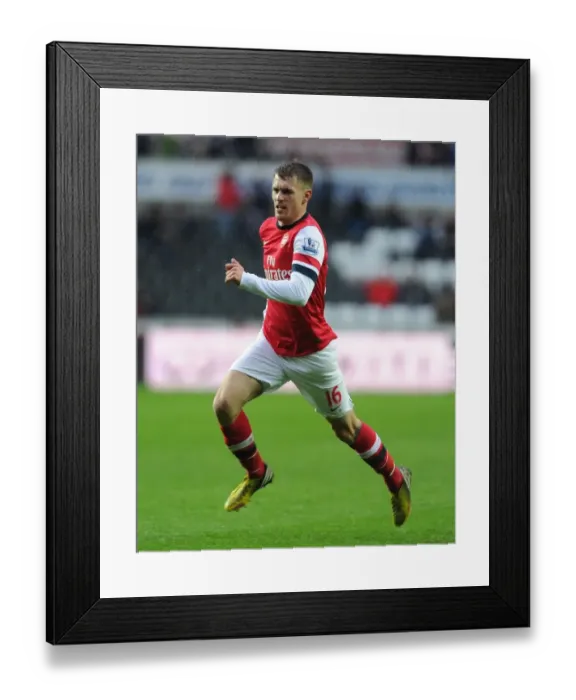 Framed Print : Aaron Ramsey in Action: Swansea City vs. Arsenal, Premier League 2012-13 Framed Print : Aaron Ramsey in Action: Swansea City vs. Arsenal, Premier League 2012-13