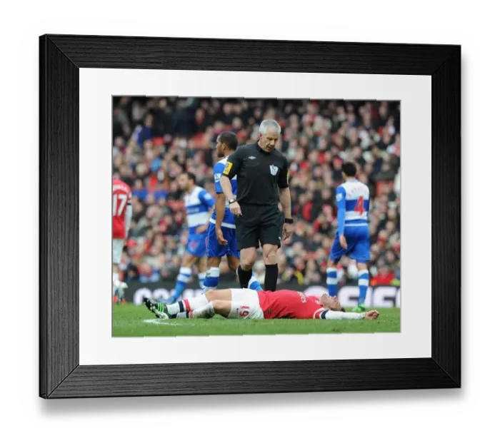 Framed Print : Arsenal's Santi Cazorla Injured During Arsenal v Reading Premier League Match Framed Print : Arsenal's Santi Cazorla Injured During Arsenal v Reading Premier League Match