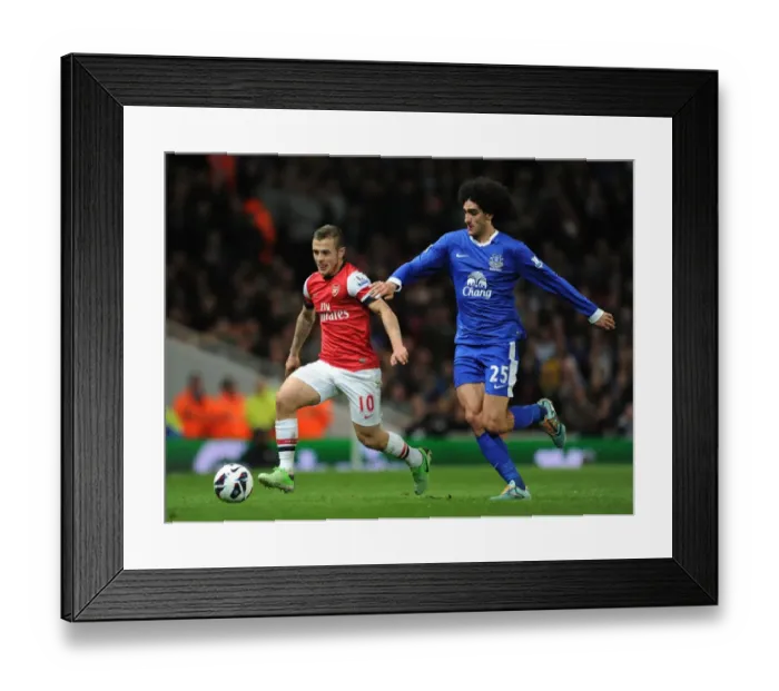 Framed Print : Intense Rivalry: Jack Wilshere vs. Marouane Fallaini Clash in Arsenal vs. Everton Premier League Match