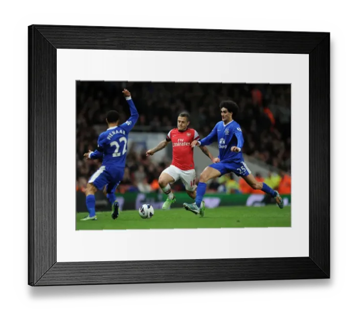 Framed Print : Arsenal's Jack Wilshere Faces Off Against Everton's Steven Pienaar and Marouane Fellaini Framed Print : Arsenal's Jack Wilshere Faces Off Against Everton's Steven Pienaar and Marouane Fellaini