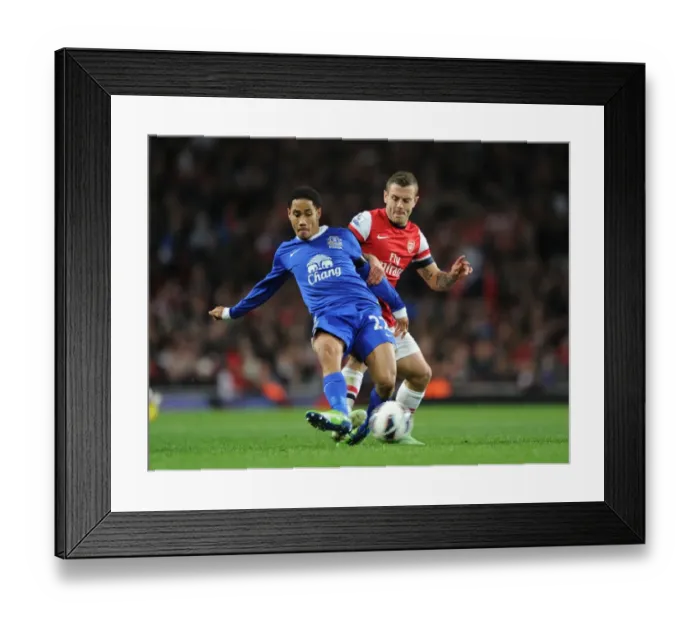 Framed Print : Arsenal vs. Everton: Wilshere vs. Pienaar in Intense Premier League Clash