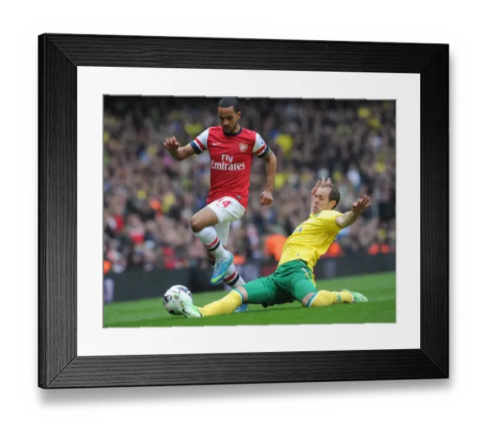 Framed Print : Theo Walcott vs. Steven Whittaker: Intense Battle at Arsenal v Norwich City, Premier League 2012-13 Framed Print : Theo Walcott vs. Steven Whittaker: Intense Battle at Arsenal v Norwich City, Premier League 2012-13