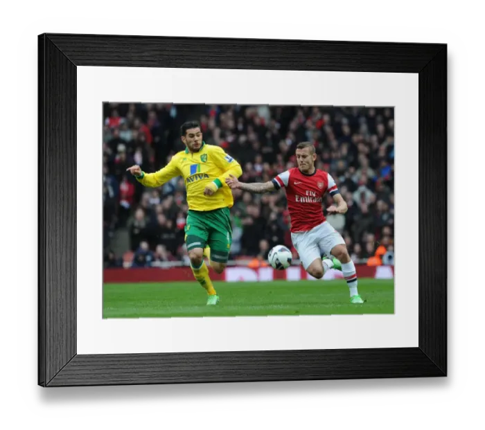 Framed Print : Jack Wilshere vs Bradley Johnson: Intense Battle at Arsenal v Norwich City, Premier League 2012-13
