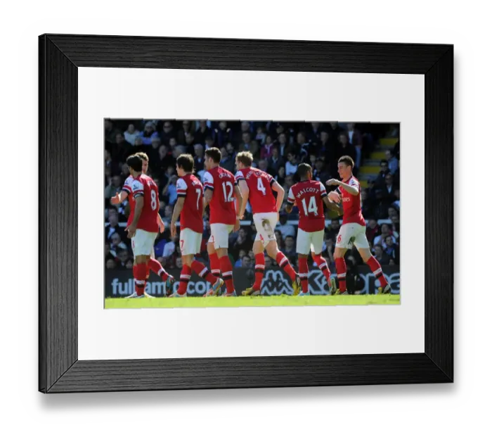 Framed Print : Per Mertesacker celebrates scoring his goal for Arsenal with his team mates. Fulham 0: 1 Arsenal Framed Print : Per Mertesacker celebrates scoring his goal for Arsenal with his team mates. Fulham 0: 1 Arsenal