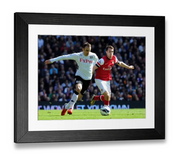 Framed Print : Ramsey Closes In: Intense Battle Between Aaron Ramsey and Dimitar Berbatov in Fulham vs Arsenal Premier League Clash Framed Print : Ramsey Closes In: Intense Battle Between Aaron Ramsey and Dimitar Berbatov in Fulham vs Arsenal Premier League Clash