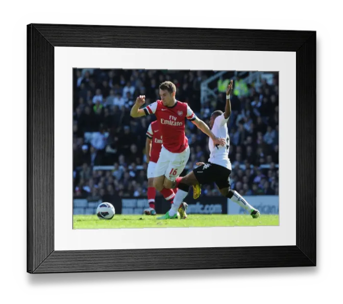Framed Print : Clash on the Thames: Ramsey vs. Enoh in Fulham vs. Arsenal Premier League Battle Framed Print : Clash on the Thames: Ramsey vs. Enoh in Fulham vs. Arsenal Premier League Battle