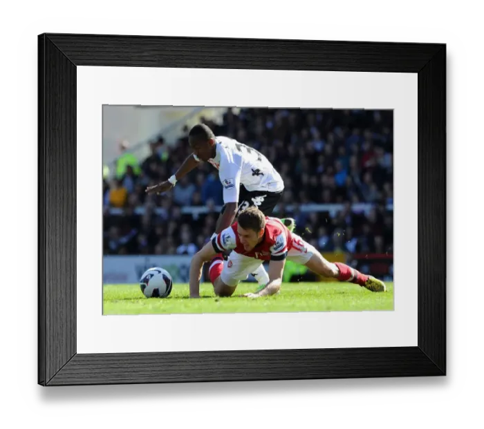 Framed Print : Clash at Craven Cottage: Ramsey vs. Enoh, April 2013 - Fulham vs. Arsenal, Premier League Framed Print : Clash at Craven Cottage: Ramsey vs. Enoh, April 2013 - Fulham vs. Arsenal, Premier League