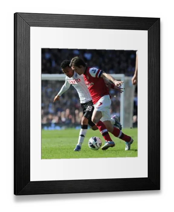 Framed Print : Arsenal's Tomas Rosicky Fends Off Urby Emanuelson in Intense Fulham Clash