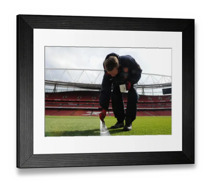 Framed Print : Arsenal's Groundsmen Prepare Emirates Stadium for Arsenal v Reading (2013)