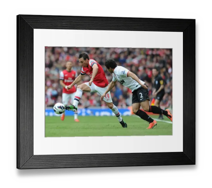 Framed Print : Santi Cazorla's Masterful Maneuver: Outsmarting Rafael in Arsenal's Premier League Victory over Manchester United (April 2013) Framed Print : Santi Cazorla's Masterful Maneuver: Outsmarting Rafael in Arsenal's Premier League Victory over Manchester United (April 2013)