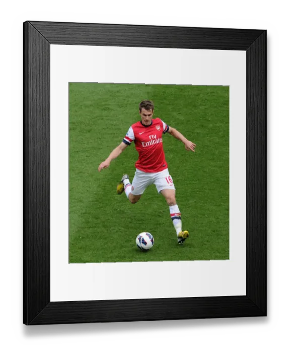Framed Print : Arsenal's Aaron Ramsey Faces Off Against Manchester United in Premier League Showdown Framed Print : Arsenal's Aaron Ramsey Faces Off Against Manchester United in Premier League Showdown