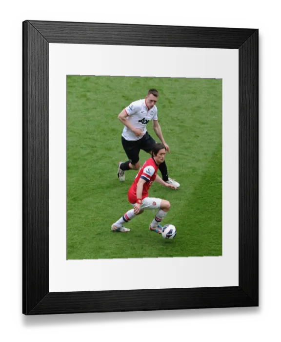 Framed Print : Arsenal's Rosicky Faces Off Against Manchester United's Jones: A Premier League Showdown