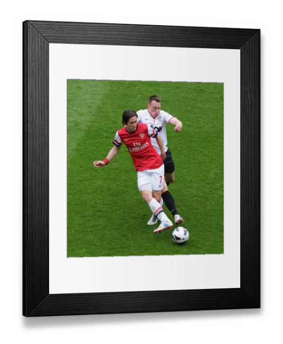 Framed Print : Arsenal's Rosicky Evades Manchester United's Jones: A Premier League Battle