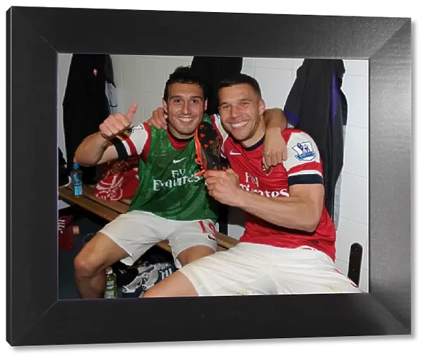 Celebrating Victory: Santi Cazorla and Lukas Podolski of Arsenal