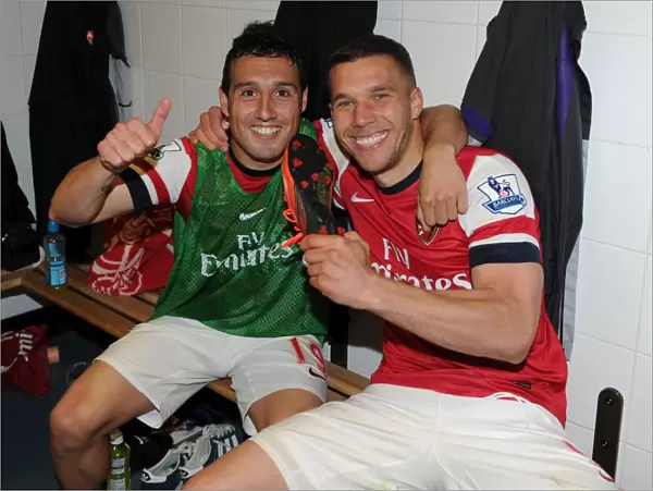 Celebrating Victory: Santi Cazorla and Lukas Podolski of Arsenal