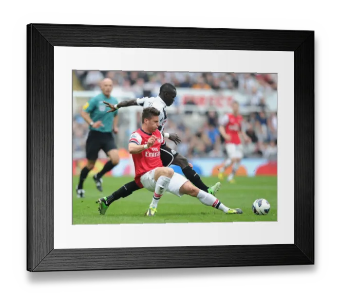Framed Print : Clash at St. James Park: Olivier Giroud vs. Cheick Tiote, Newcastle United vs. Arsenal (Premier League 2012-13) Framed Print : Clash at St. James Park: Olivier Giroud vs. Cheick Tiote, Newcastle United vs. Arsenal (Premier League 2012-13)