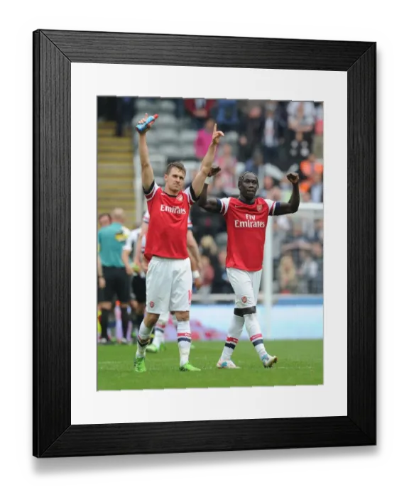 Framed Print : Celebrating Victory: Ramsey and Sagna's Moment of Triumph after Arsenal's Win at Newcastle United (2012-13) Framed Print : Celebrating Victory: Ramsey and Sagna's Moment of Triumph after Arsenal's Win at Newcastle United (2012-13)