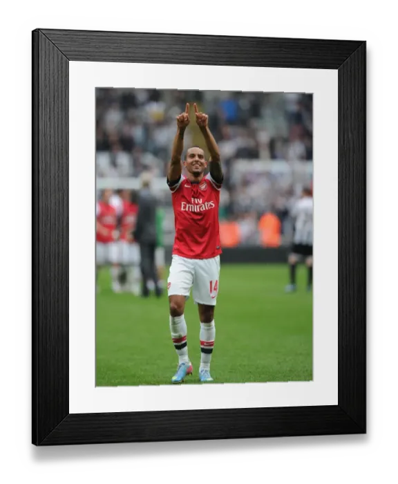 Framed Print : Theo Walcott's Euphoric Moment: Arsenal's Triumph over Newcastle United (2012-13)