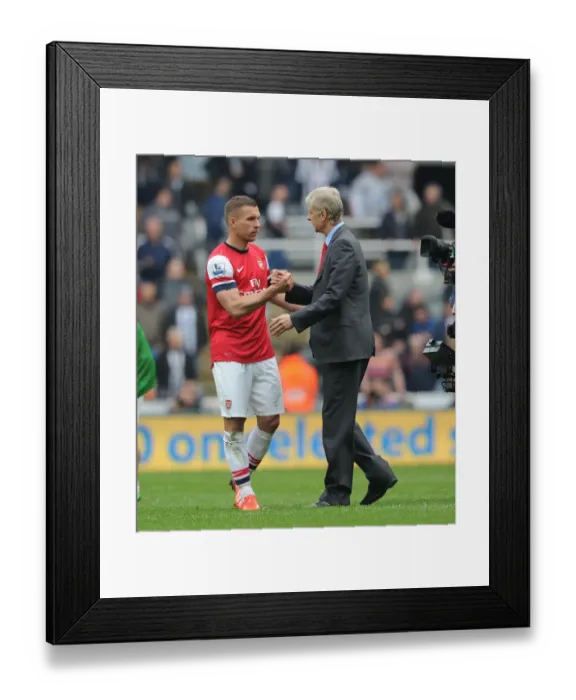 Framed Print : Arsene Wenger and Lukas Podolski Celebrate Arsenal's Win at Newcastle United (2012-13)