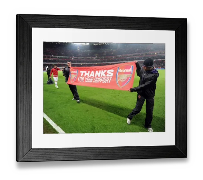 Framed Print : Ballboys banner during the lap of appreciation at the end of the match. Arsenal 4: 1 Wigan Athletic