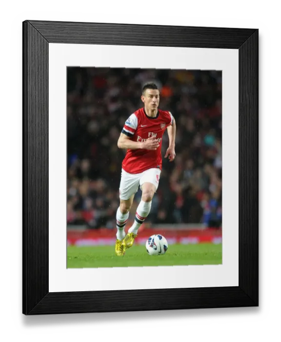 Framed Print : Laurent Koscielny (Arsenal). Arsenal 4: 1 Wigan Athletic. Barclays Premier League