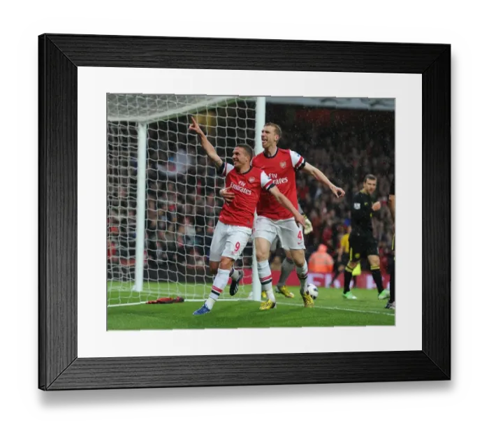 Framed Print : Arsenal's Unforgettable Goal Celebration: Podolski and Mertesacker's Emotional Moment (Arsenal vs Wigan Athletic, 2013)