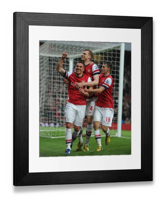 Framed Print : Arsenal's Triumphant Trio: Podolski, Mertesacker, and Ramsey's Euphoric Goal Dance (2012-13)
