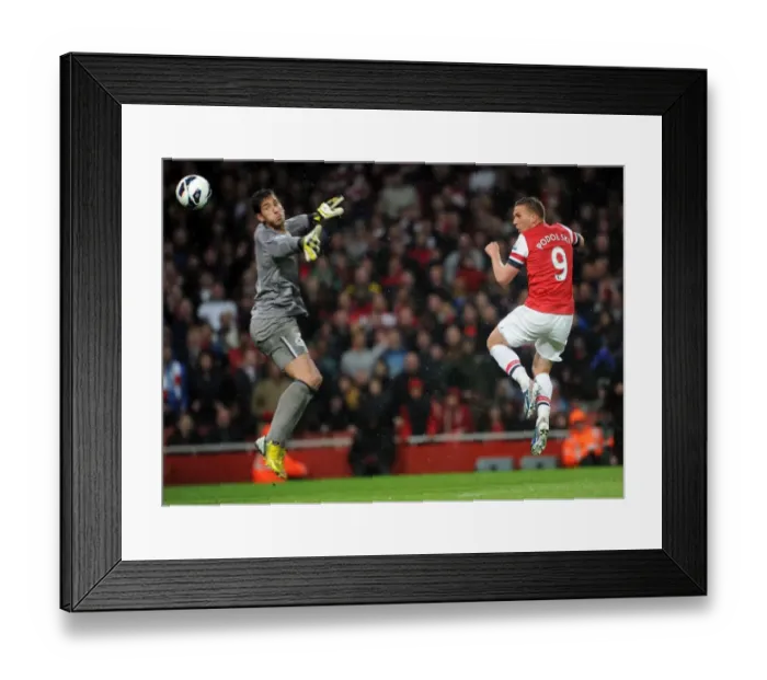 Framed Print : Podolski's Brace: Arsenal's Dominant 4-1 Victory over Wigan Athletic in the Premier League 2012-13 Framed Print : Podolski's Brace: Arsenal's Dominant 4-1 Victory over Wigan Athletic in the Premier League 2012-13