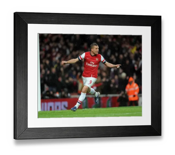 Framed Print : Podolski's Brace: Arsenal Crushes Wigan Athletic 4-1 in Premier League Framed Print : Podolski's Brace: Arsenal Crushes Wigan Athletic 4-1 in Premier League