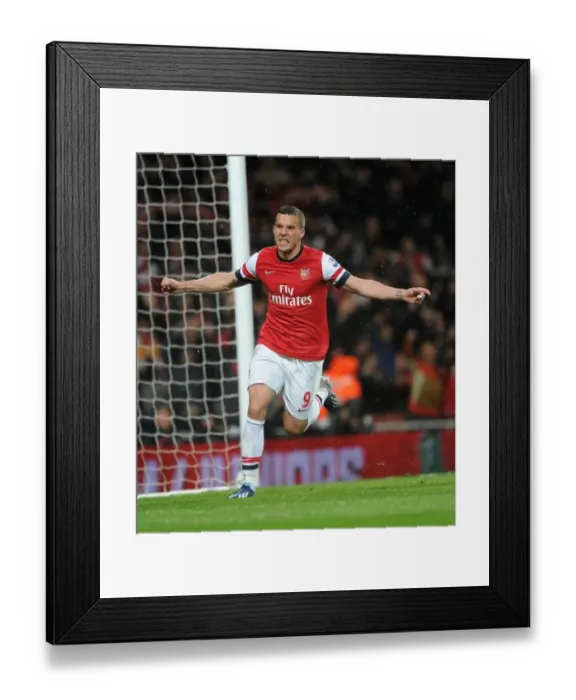 Framed Print : Lukas Podolski celebrates scoring his 2nd goal Arsenals 3rd. Arsenal 4: 1 Wigan Athletic
