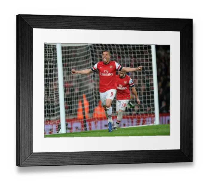 Framed Print : Arsenal's Dominance: Podolski's Brace Secures 4-1 Premier League Victory Over Wigan Athletic