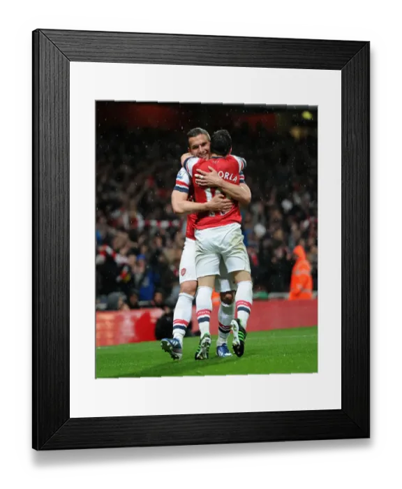 Framed Print : Podolski and Cazorla's Double Strike: Arsenal's Dominance Over Wigan Athletic (4-1)