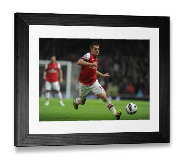 Framed Print : Aaron Ramsey (Arsenal). Arsenal 4: 1 Wigan Athletic. Barclays Premier League. Emirates Stadium