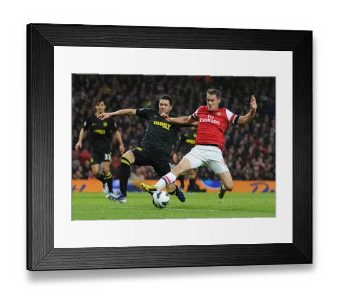 Framed Print : Arsenal vs. Wigan Athletic: Ramsey vs. Alcaraz Clash in Premier League Showdown