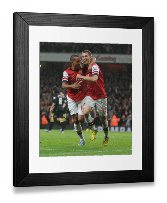 Framed Print : Arsenal's Ramsey and Walcott in Jubilant Moment after Scoring against Wigan Athletic (2012-13) Framed Print : Arsenal's Ramsey and Walcott in Jubilant Moment after Scoring against Wigan Athletic (2012-13)