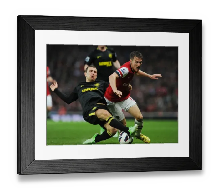 Framed Print : Arsenal's Aaron Ramsey Outmaneuvers Wigan's James McArthur