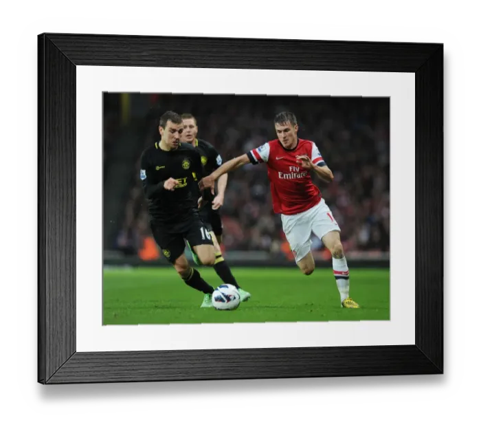 Framed Print : Arsenal's Aaron Ramsey Outmaneuvers James McArthur: A Premier League Clash Framed Print : Arsenal's Aaron Ramsey Outmaneuvers James McArthur: A Premier League Clash